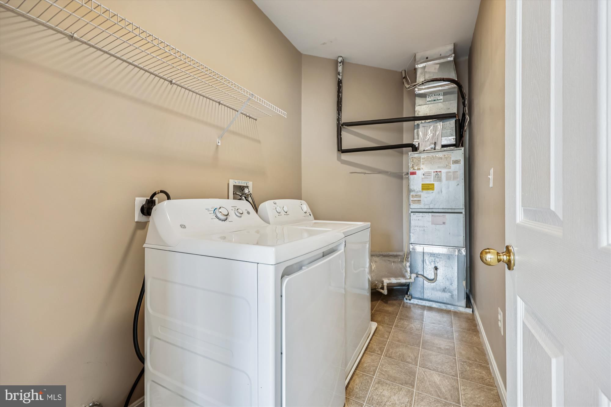 12701 Found Stone Road, Unit 201 Germantown, MD 20876 - Photo 22 of 41 a utility room with dryer and washer