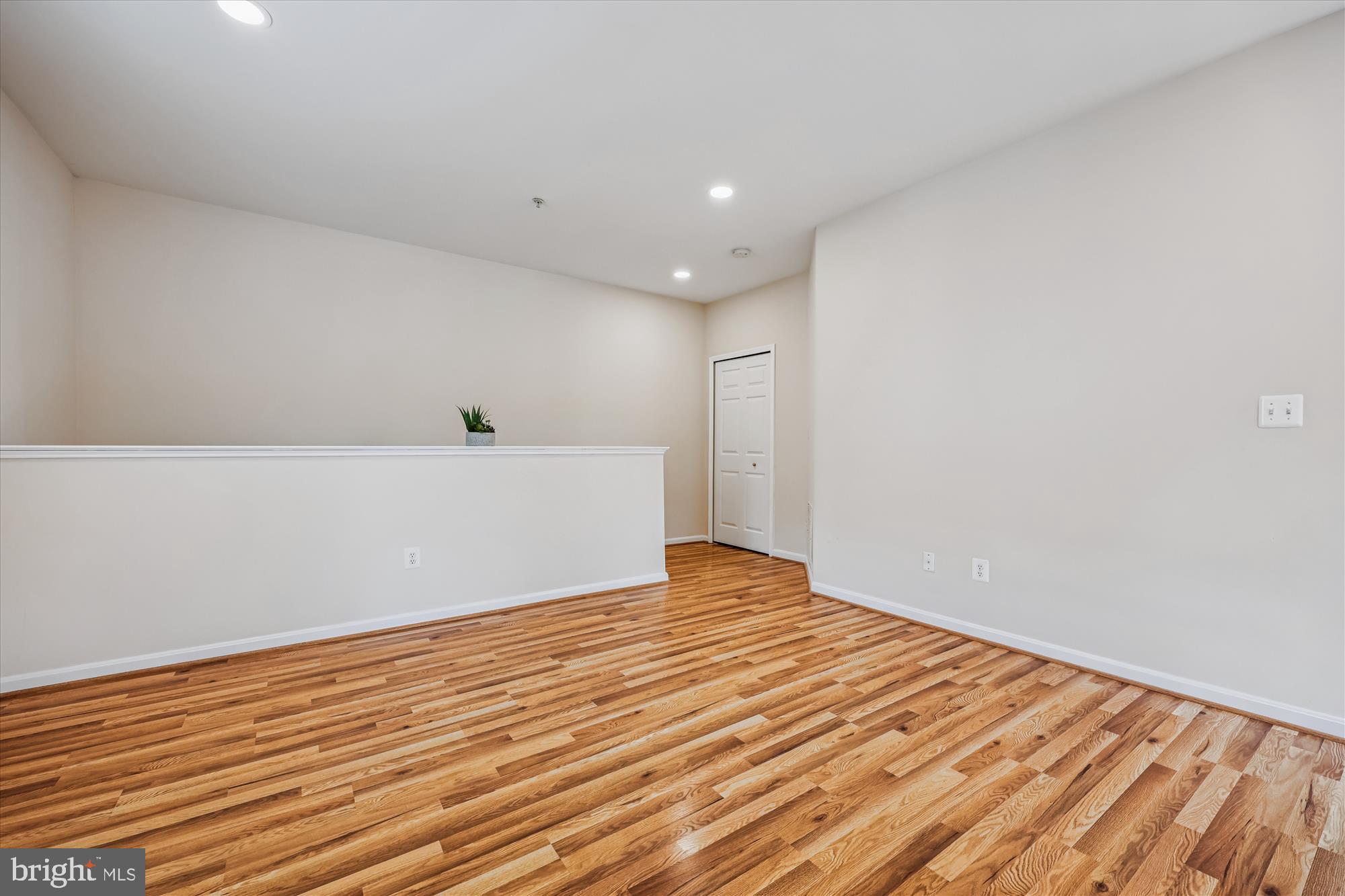 12701 Found Stone Road, Unit 201 Germantown, MD 20876 - Photo 23 of 41 a view of an empty room with wooden floor