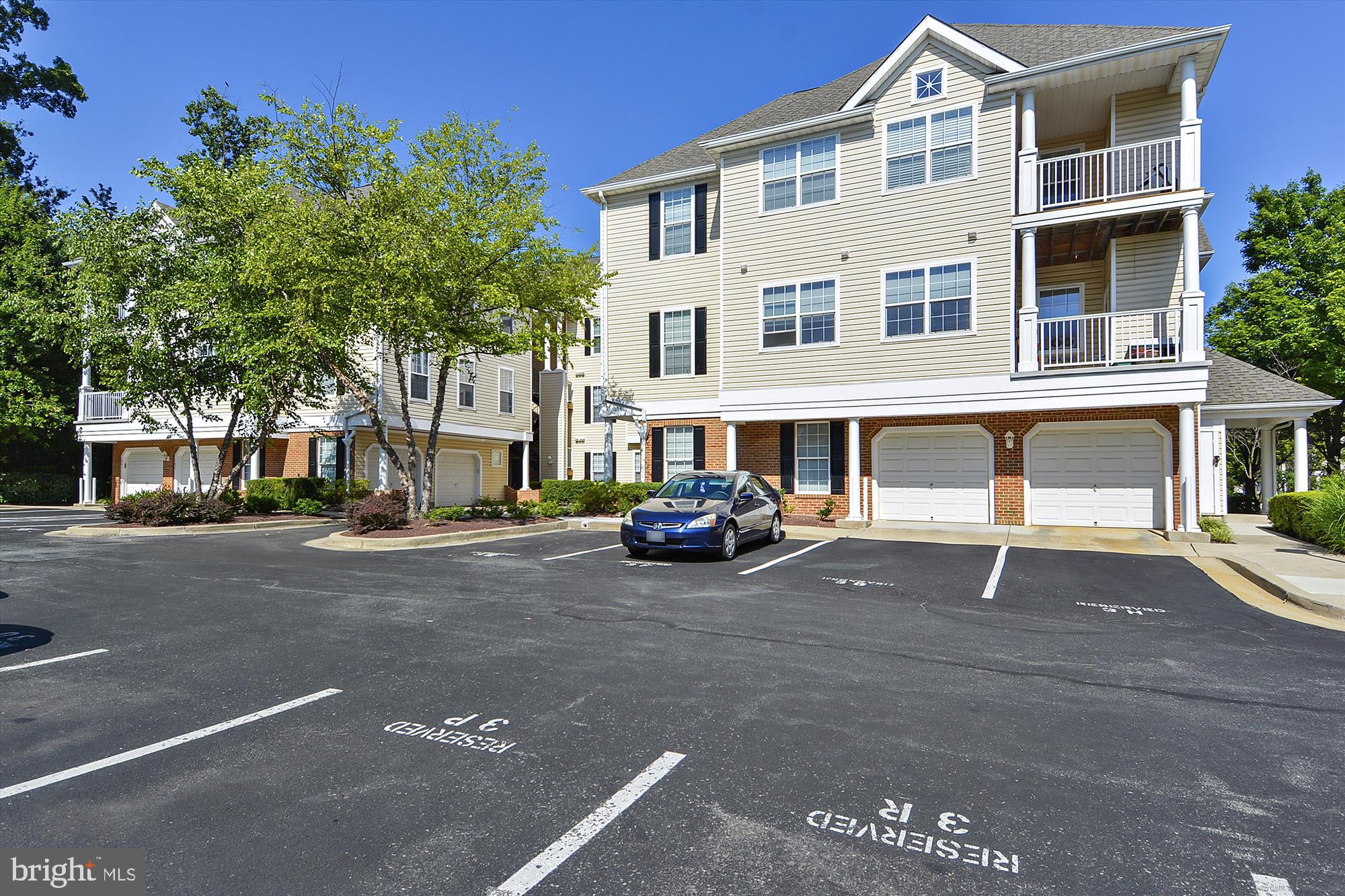 12701 Found Stone Road, Unit 201 Germantown, MD 20876 - Photo 24 of 41 a view of a street with cars parked in front of it