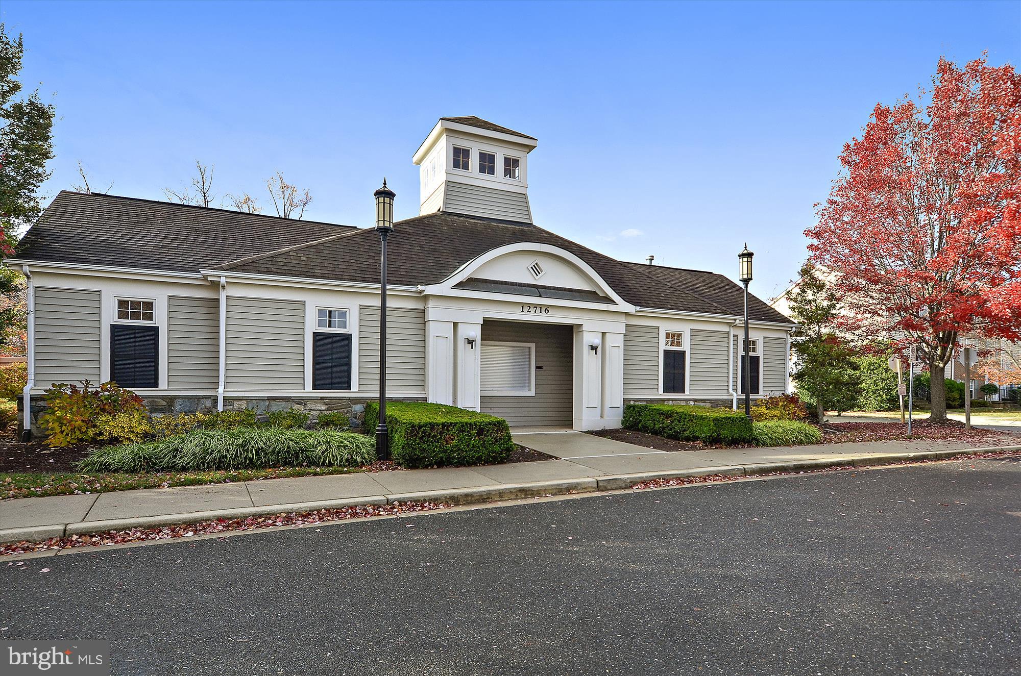12701 Found Stone Road, Unit 201 Germantown, MD 20876 - Photo 27 of 41 a front view of a house with a yard and garage