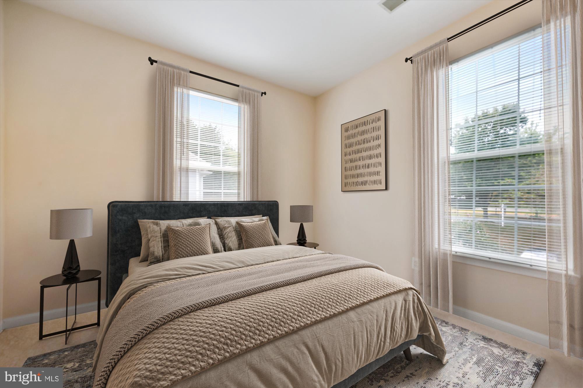 12701 Found Stone Road, Unit 201 Germantown, MD 20876 - Photo 6 of 41 a bedroom with a large bed and a window