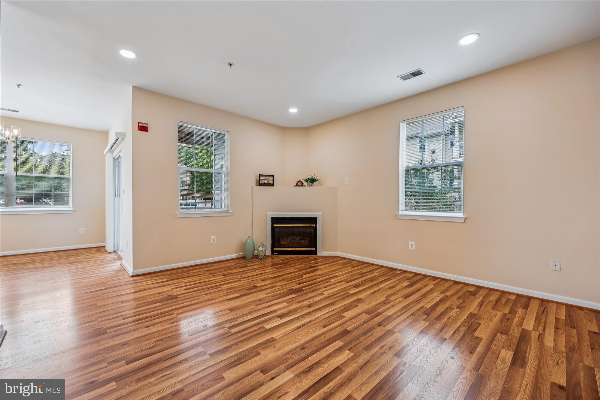 12701 Found Stone Road, Unit 201 Germantown, MD 20876 - Photo 7 of 41 a view of an empty room with a window and fire place