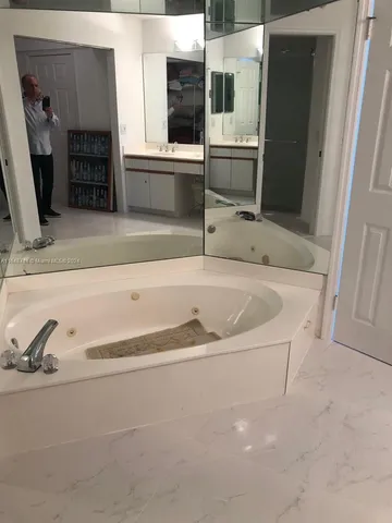 a bath tub sitting in a bathroom