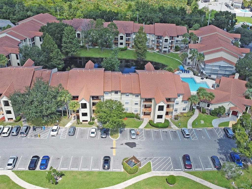 an aerial view of residential houses with outdoor space and street view