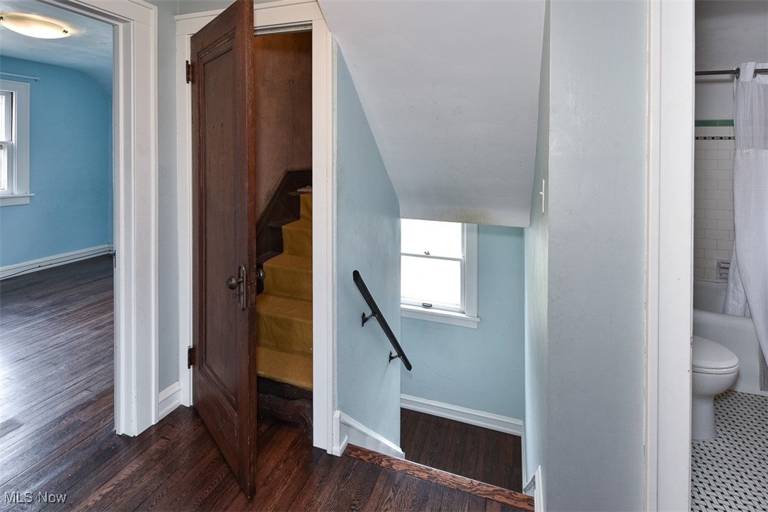 999 Pennfield Road Cleveland, OH 44121 - Photo 26 of 42 Stairs featuring wood-type flooring