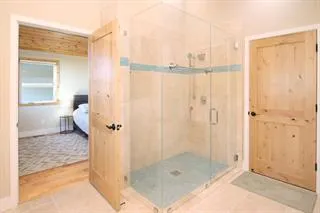 a view of a bathroom with a shower and a bathroom