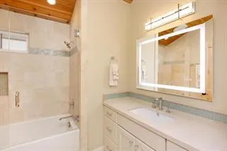 a bathroom with a sink and a bathtub