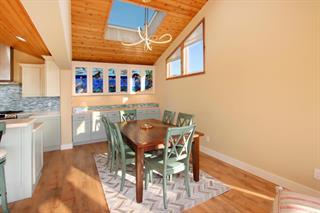 2395 Delaware, Unit 167 Santa Cruz, CA 95060 - Photo 4 of 33 a view of a dining room with furniture and wooden floor