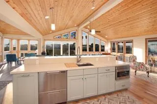 a kitchen with stainless steel appliances granite countertop a sink and cabinets