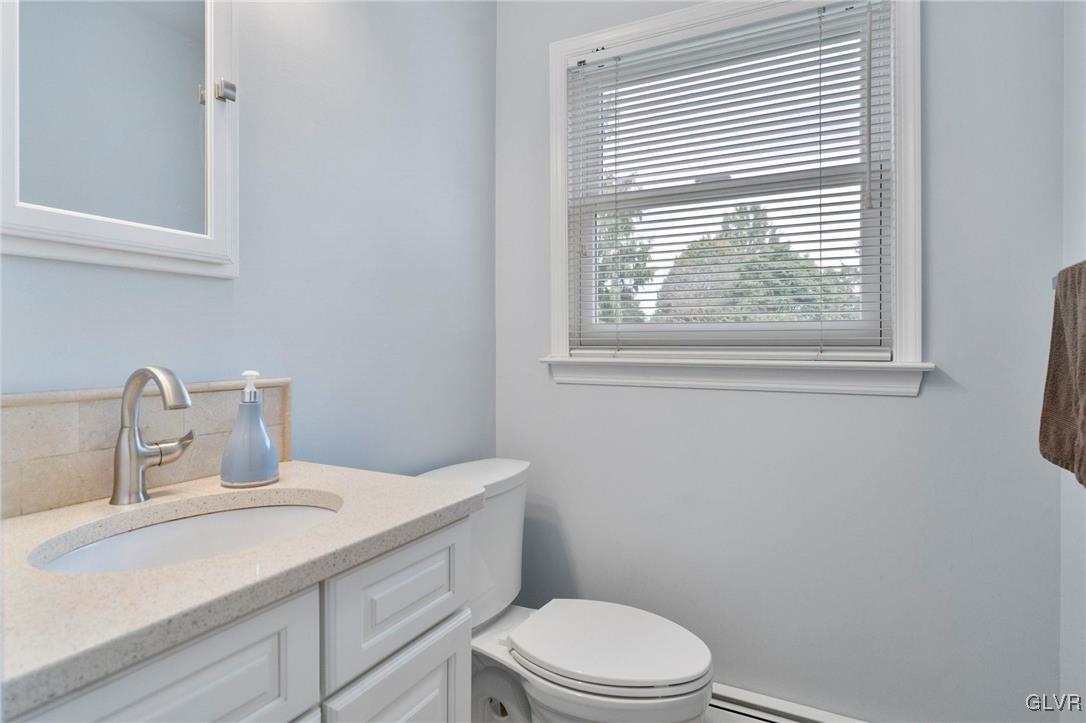3920 Hemlock Place Bethlehem, PA 18017 - Photo 13 of 39 a bathroom with a sink a toilet and a window