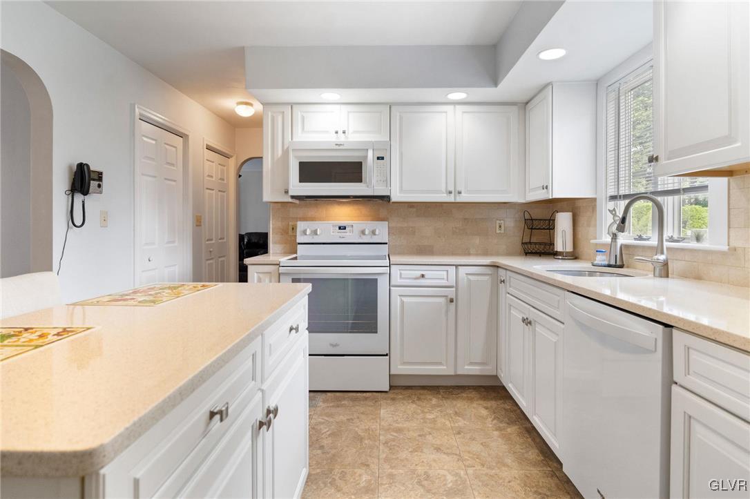 3920 Hemlock Place Bethlehem, PA 18017 - Photo 17 of 39 a kitchen with white cabinets appliances and sink