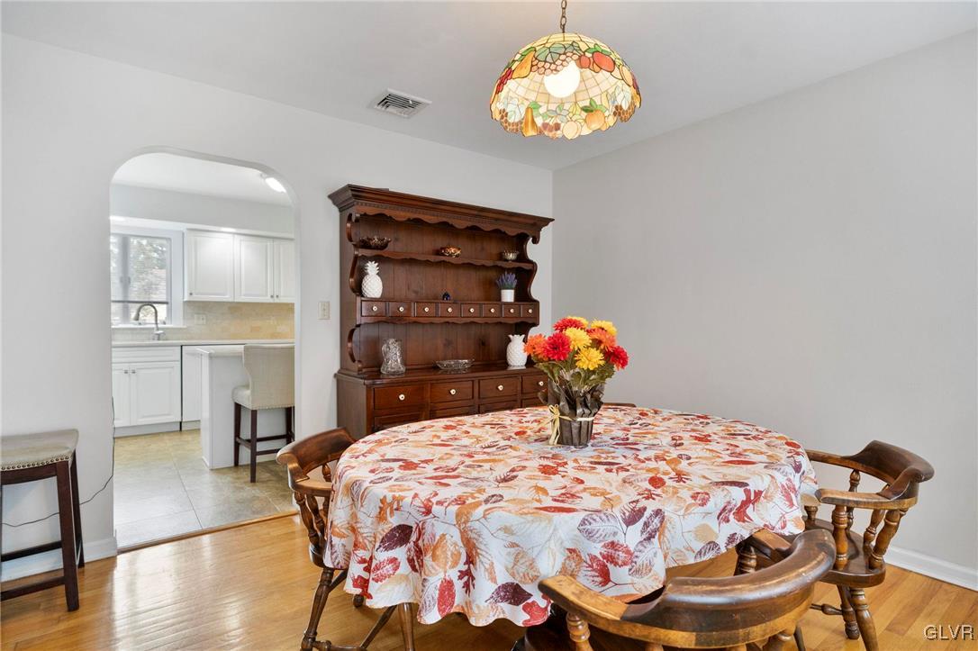 3920 Hemlock Place Bethlehem, PA 18017 - Photo 19 of 39 a bedroom with a bed and chandelier