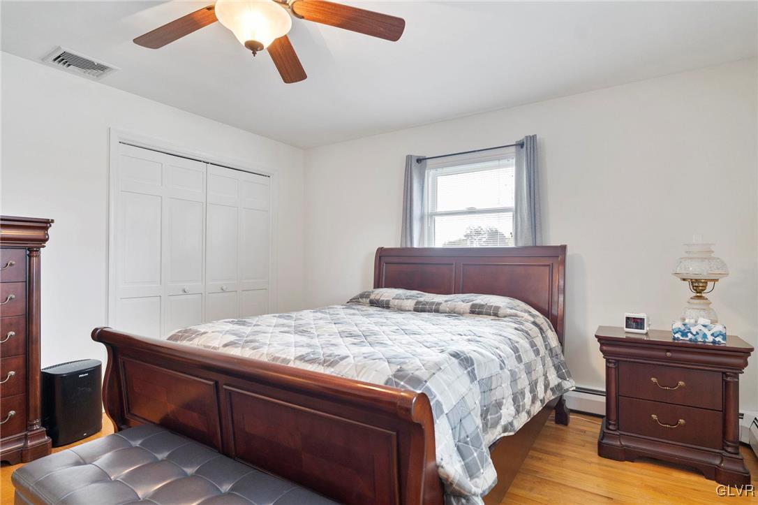 3920 Hemlock Place Bethlehem, PA 18017 - Photo 34 of 39 a bed sitting in a bedroom next to a window and a chandelier