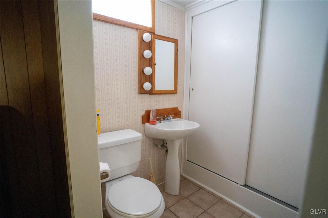 3920 Hemlock Place Bethlehem, PA 18017 - Photo 35 of 39 a bathroom with a toilet a sink and mirror