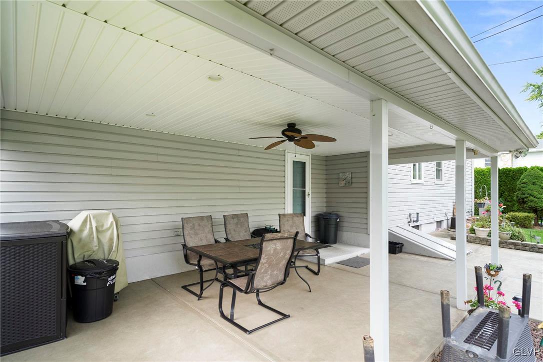 3920 Hemlock Place Bethlehem, PA 18017 - Photo 6 of 39 a patio with table and chairs and potted plants