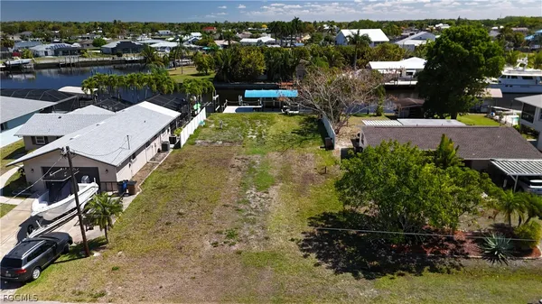 an aerial view of a house with a lake view