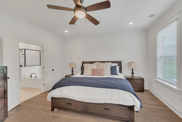 a bedroom with a bed and window