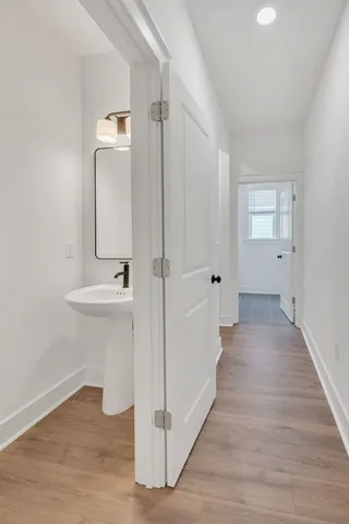 a view of a bathroom with sink and mirror