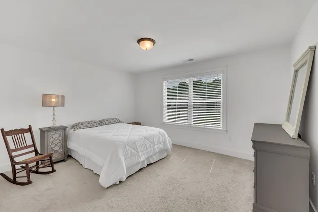 a bedroom with a bed and closet