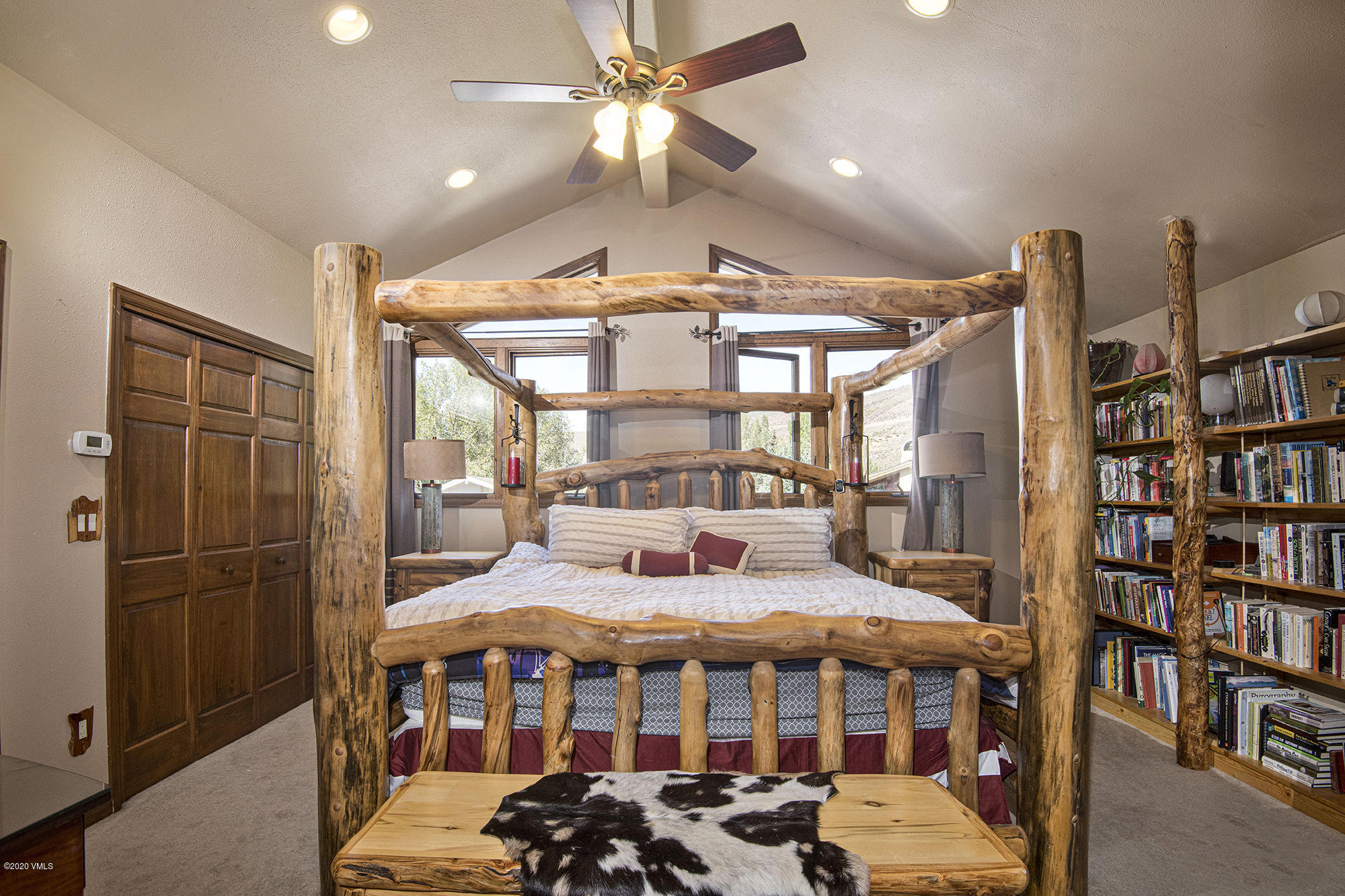34 Beaver Road, Unit B Avon, CO 81620 - Photo 15 of 34 a bedroom with furniture and a chandelier
