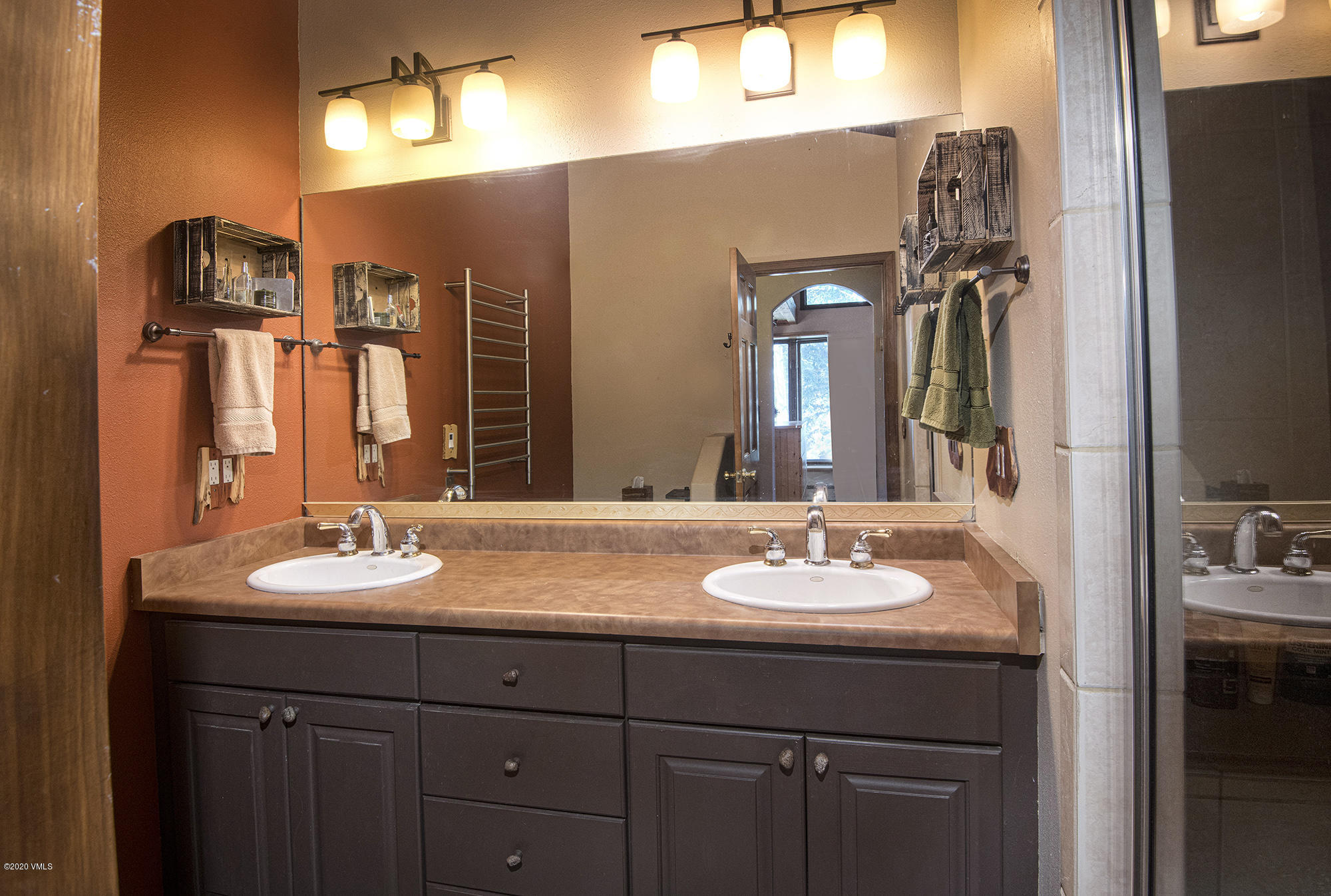 34 Beaver Road, Unit B Avon, CO 81620 - Photo 17 of 34 a bathroom with a double vanity sink and a mirror