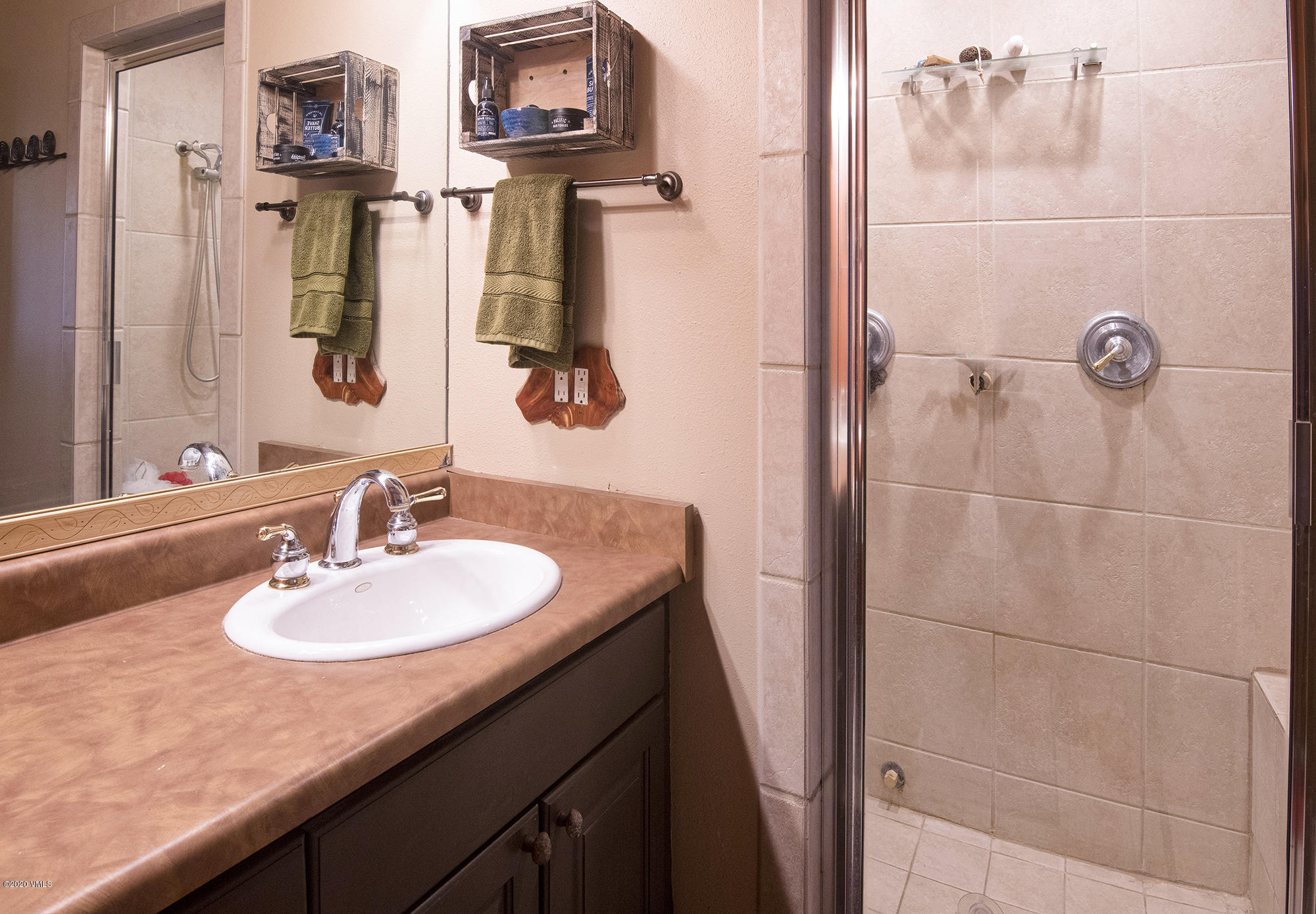 34 Beaver Road, Unit B Avon, CO 81620 - Photo 18 of 34 a bathroom with a sink and a mirror