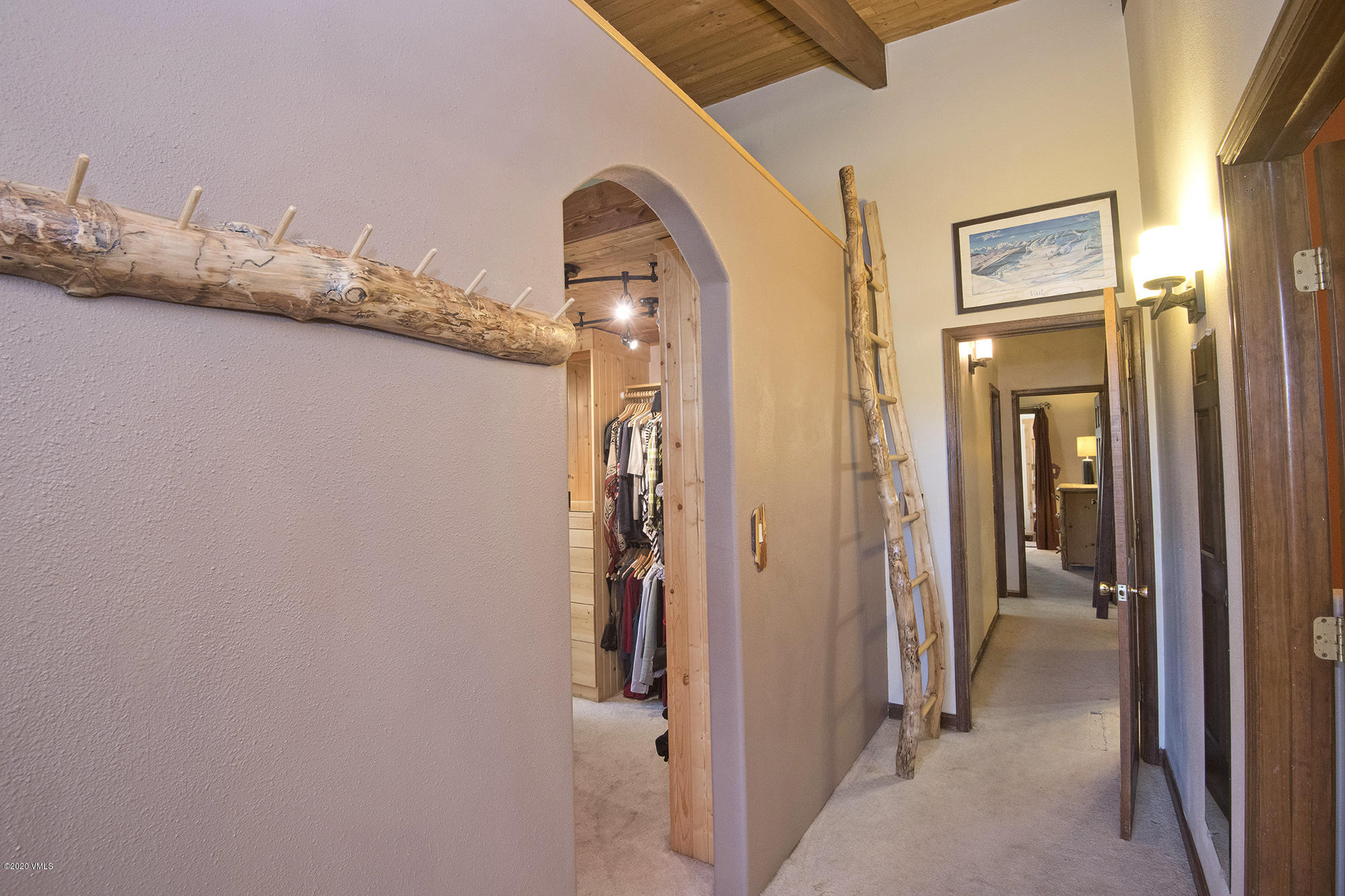 34 Beaver Road, Unit B Avon, CO 81620 - Photo 20 of 34 a view of a hallway with wooden floor and a bathroom