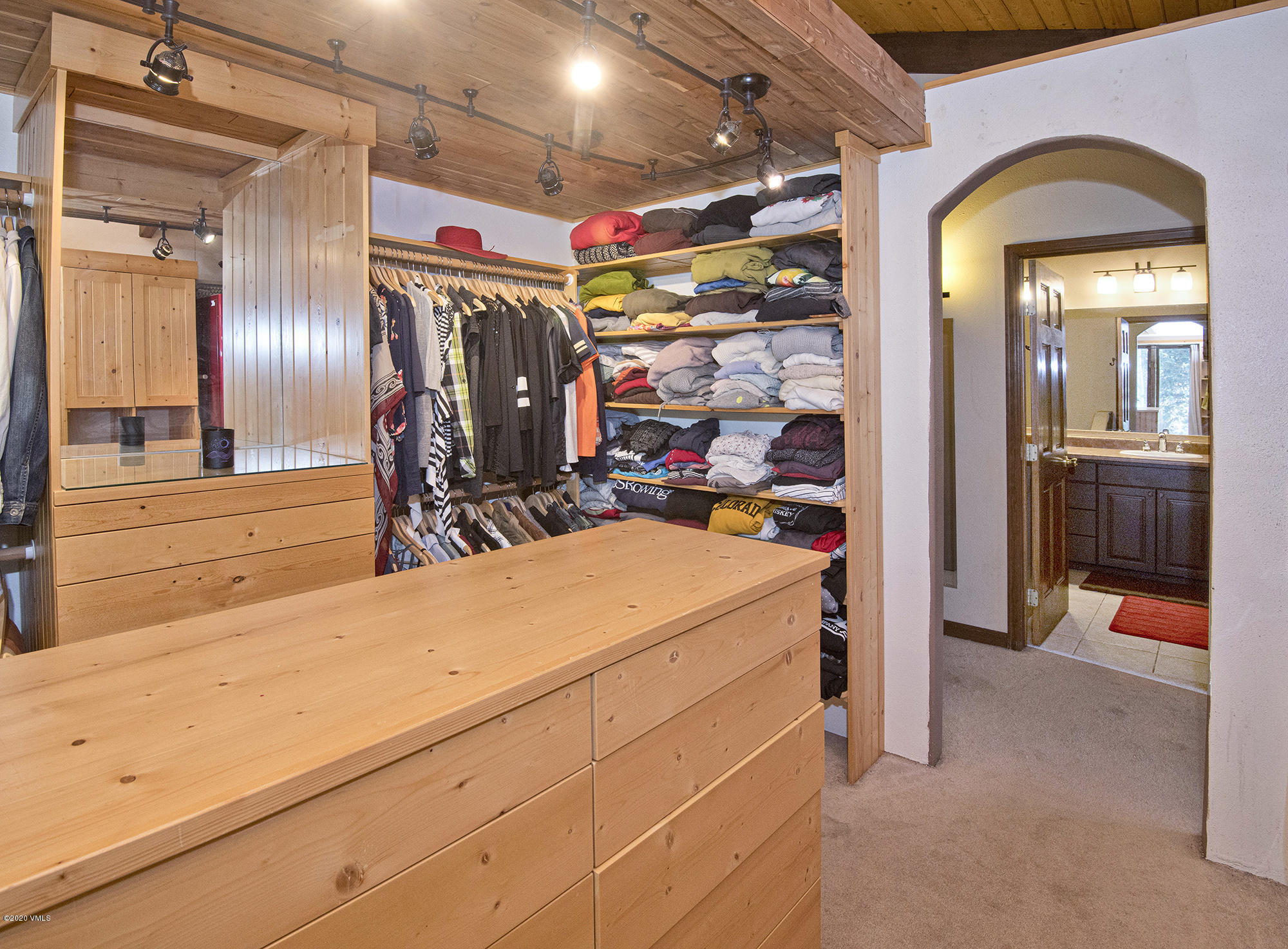 34 Beaver Road, Unit B Avon, CO 81620 - Photo 21 of 34 a view of a hallway with wooden shelves