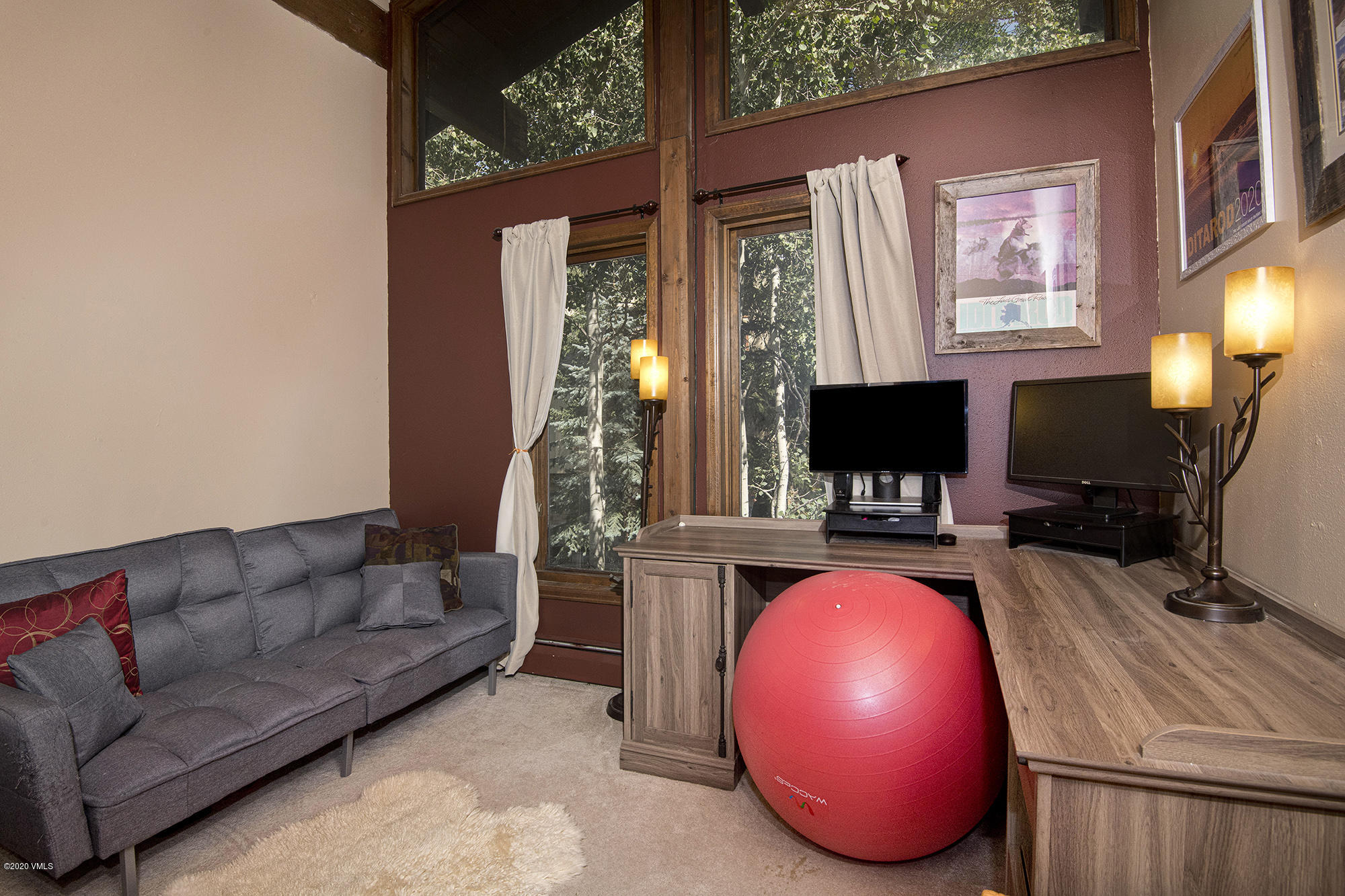 34 Beaver Road, Unit B Avon, CO 81620 - Photo 23 of 34 a living room with furniture and a flat screen tv