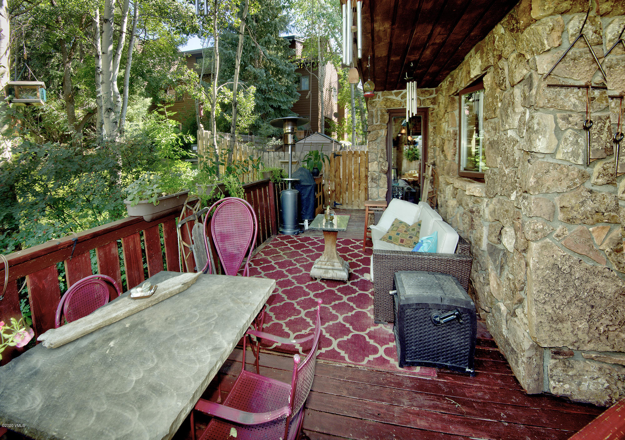 34 Beaver Road, Unit B Avon, CO 81620 - Photo 30 of 34 a backyard of a house with outdoor seating