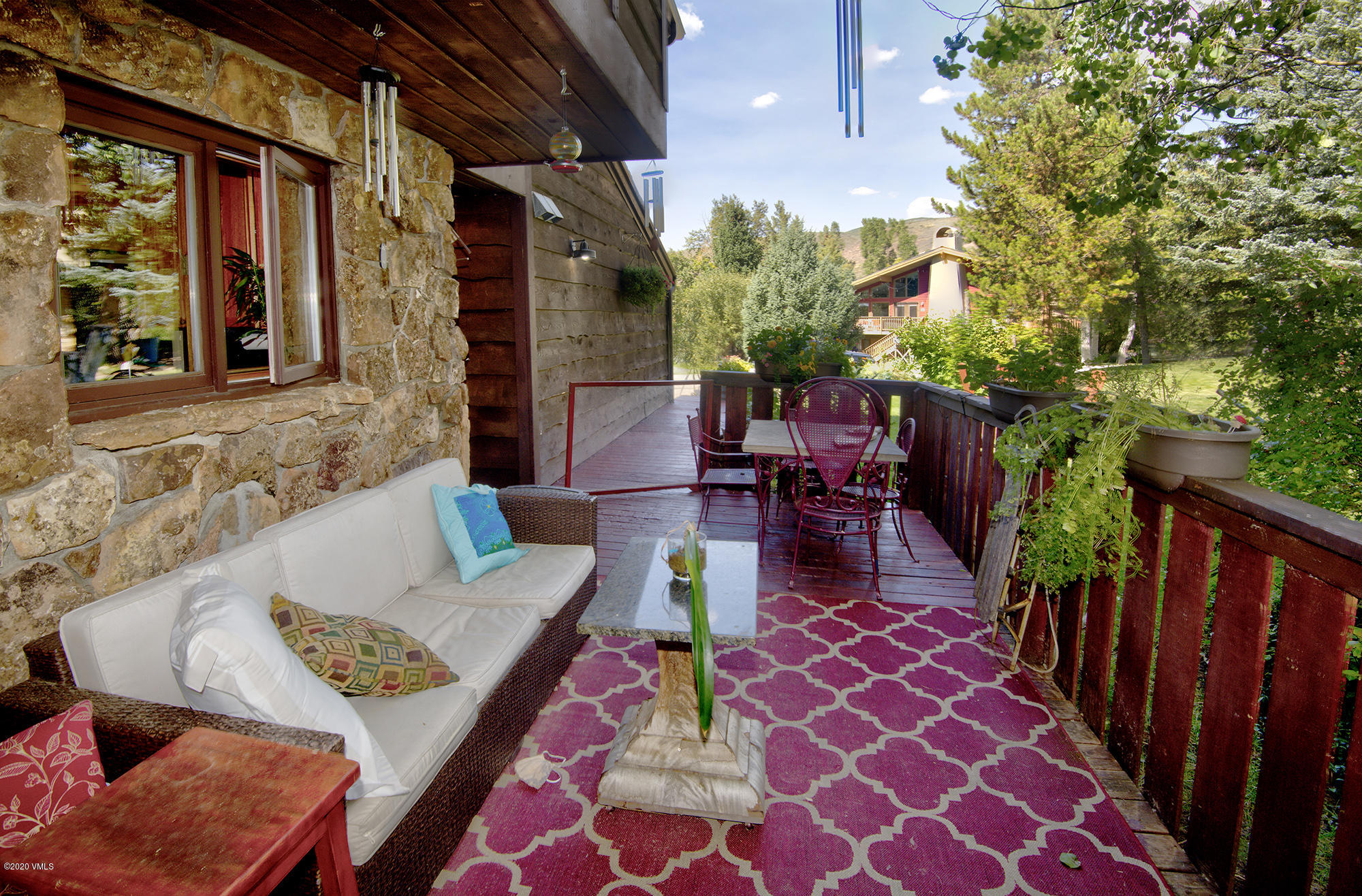 34 Beaver Road, Unit B Avon, CO 81620 - Photo 31 of 34 a view of a dinning tables and chair in the patio