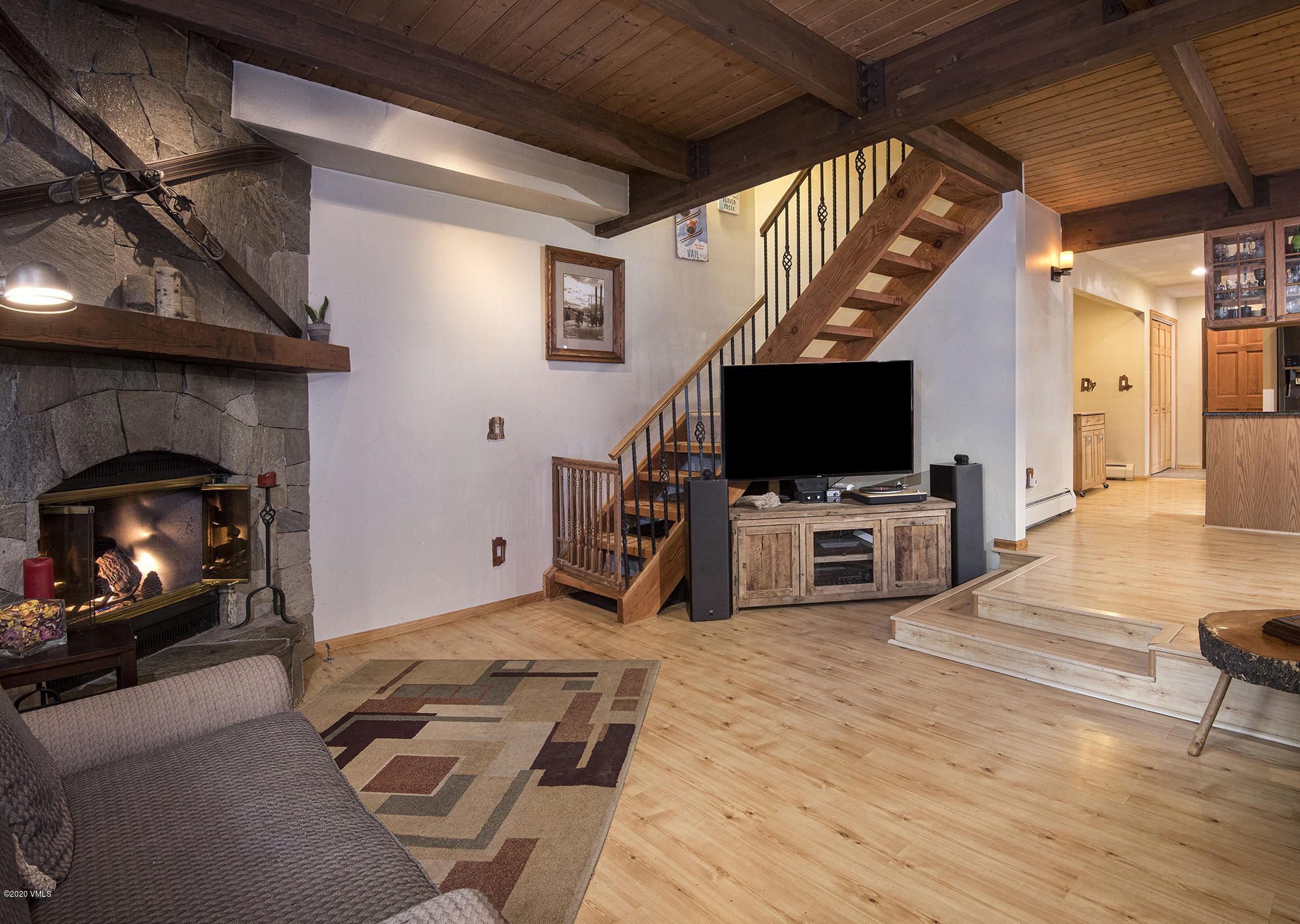 34 Beaver Road, Unit B Avon, CO 81620 - Photo 5 of 34 a view of a livingroom with furniture and a flat screen tv