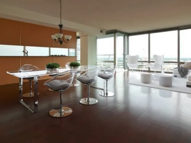 a room with lots of furniture and a large window