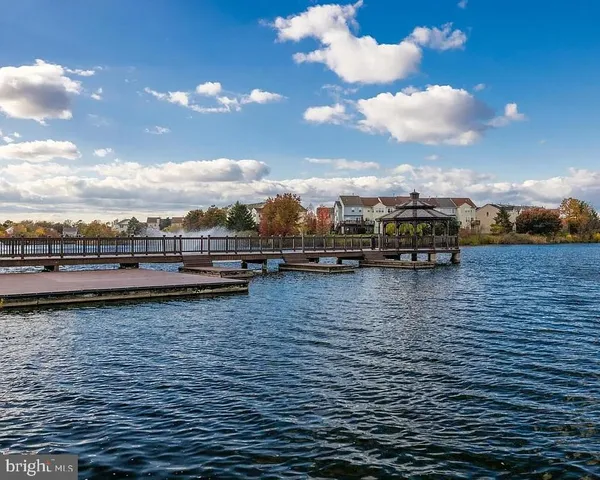 a view of a swimming pool with an outdoor seating