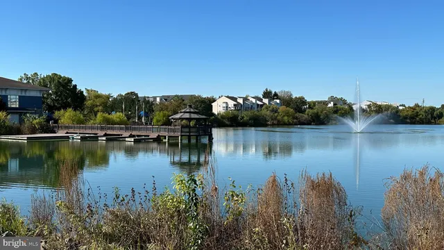 a view of a lake with houses in the back