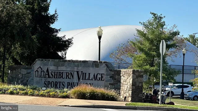 a street sign on a pole on a street