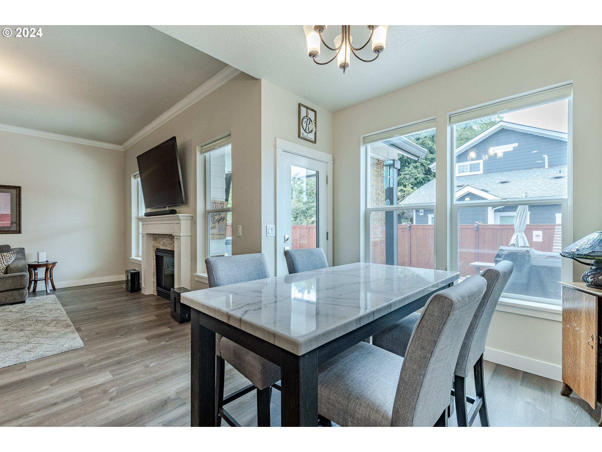 1044 West Olympic Street Springfield, OR 97477 - Photo 16 of 37 a view of a dining room with furniture window and wooden floor