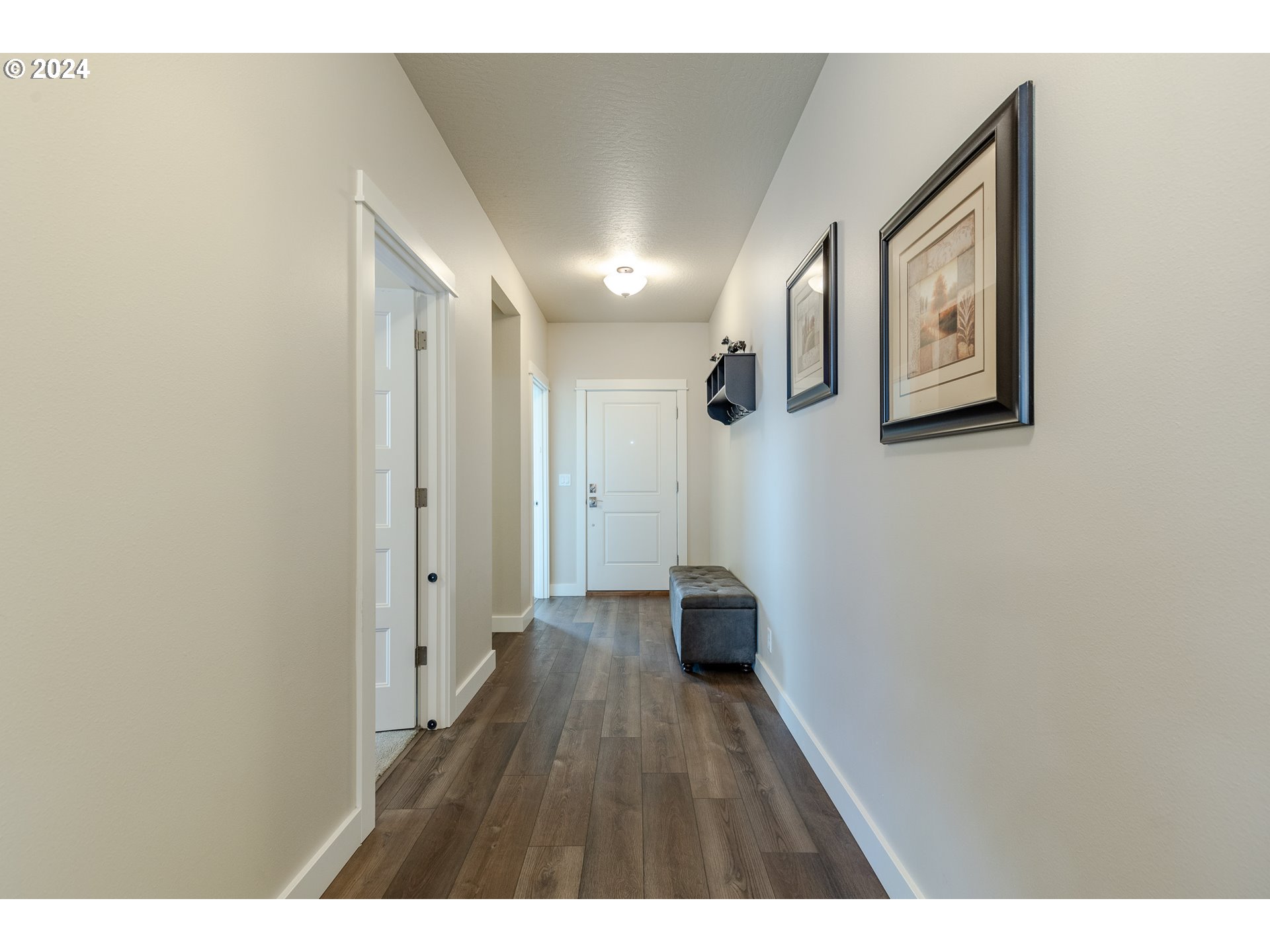 1044 West Olympic Street Springfield, OR 97477 - Photo 17 of 37 a view of hallway with stairs and wooden floor
