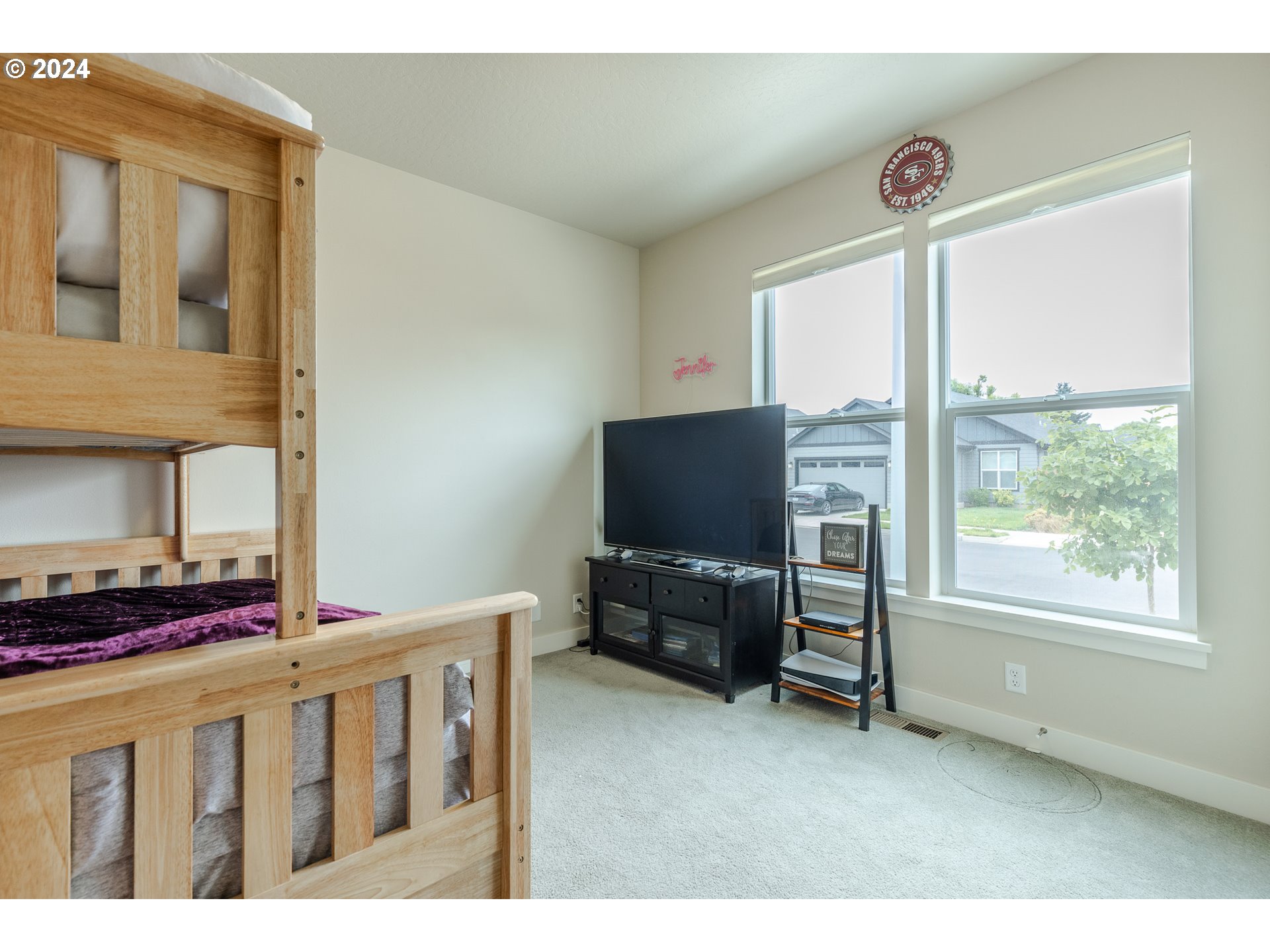 1044 West Olympic Street Springfield, OR 97477 - Photo 18 of 37 a living room with furniture and a flat screen tv