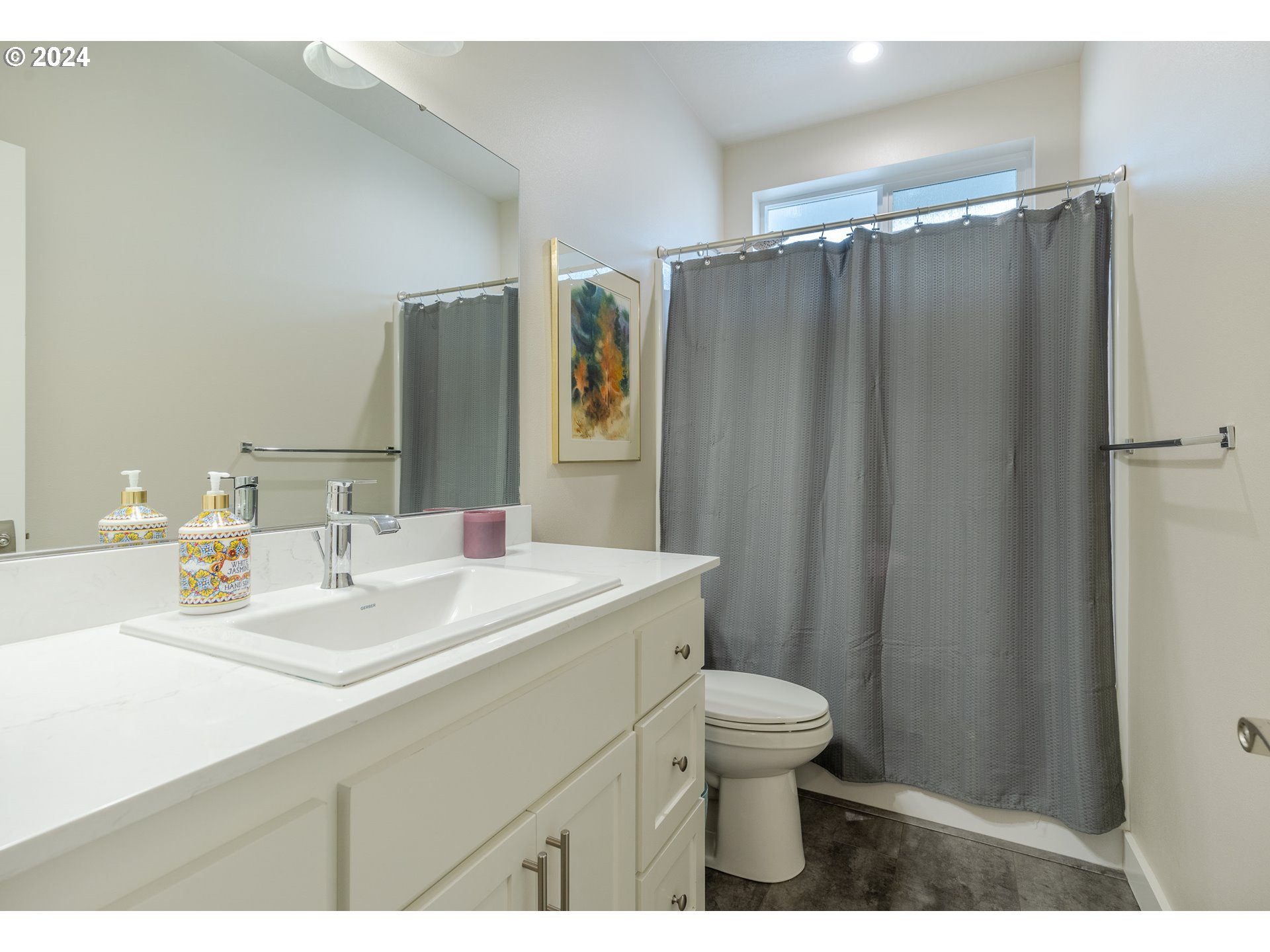 1044 West Olympic Street Springfield, OR 97477 - Photo 20 of 37 a bathroom with a sink toilet and shower