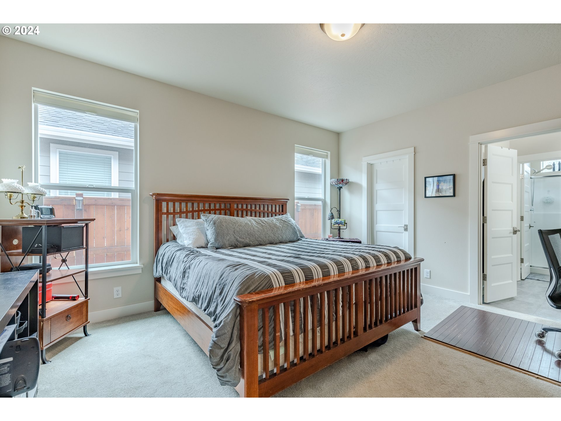 1044 West Olympic Street Springfield, OR 97477 - Photo 22 of 37 a bed sitting in a bedroom next to a window