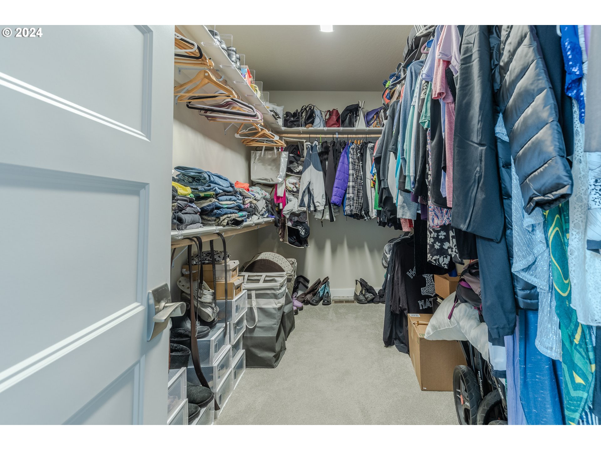 1044 West Olympic Street Springfield, OR 97477 - Photo 26 of 37 a view of walk in closet with clothes and shoes