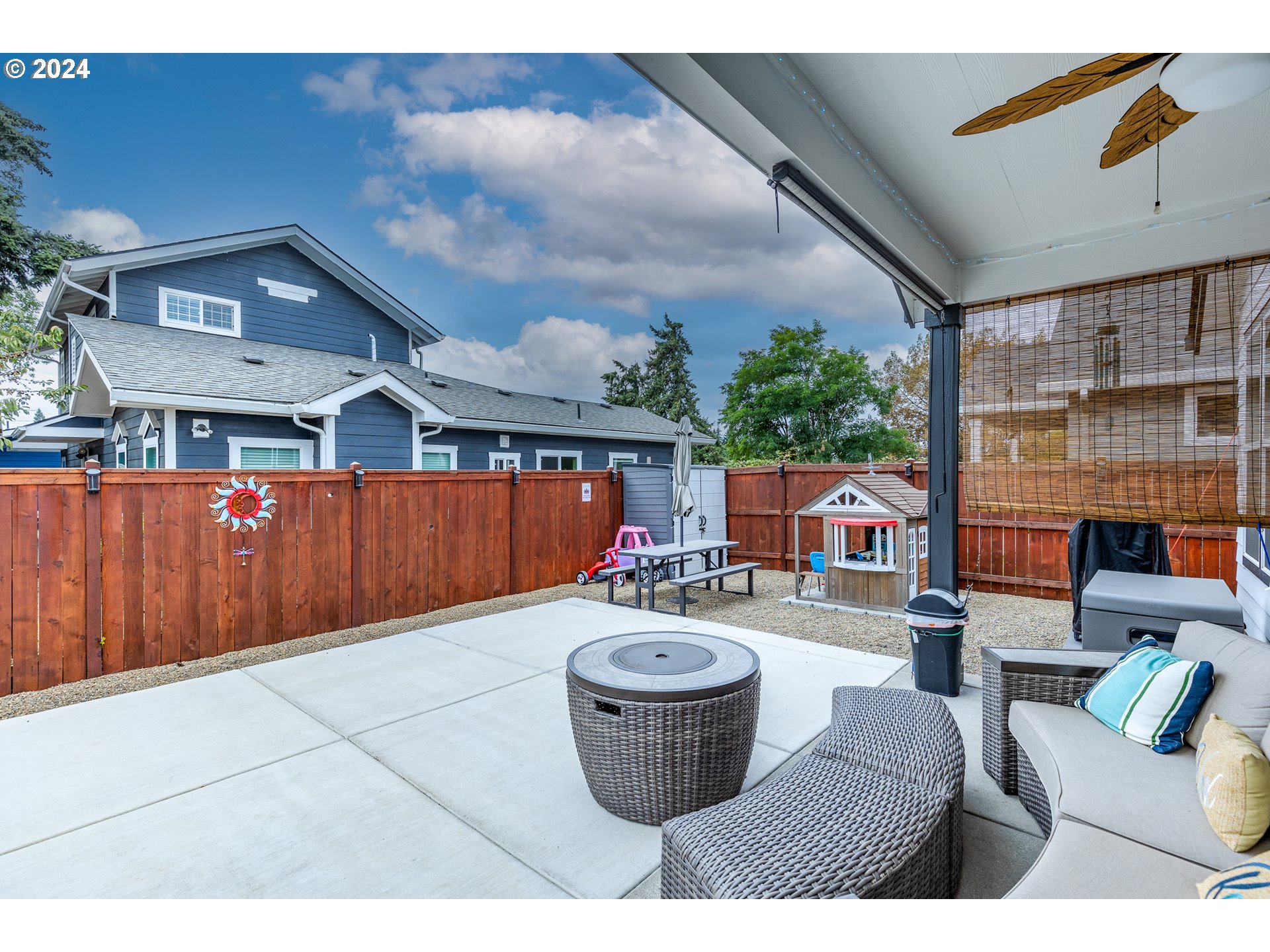 1044 West Olympic Street Springfield, OR 97477 - Photo 29 of 37 a outdoor living space with furniture and a fireplace