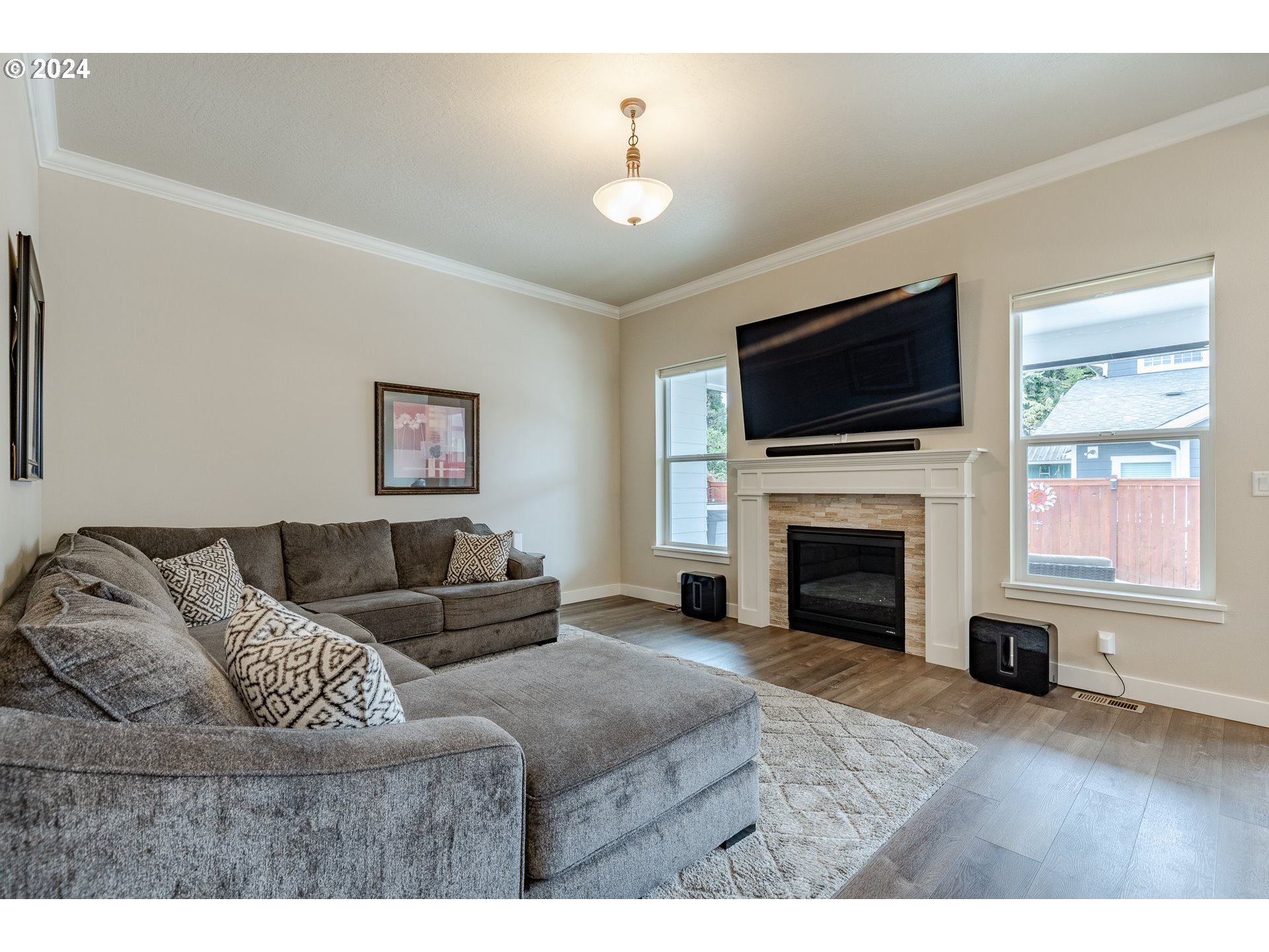 1044 West Olympic Street Springfield, OR 97477 - Photo 5 of 37 a living room with furniture fireplace and flat screen tv