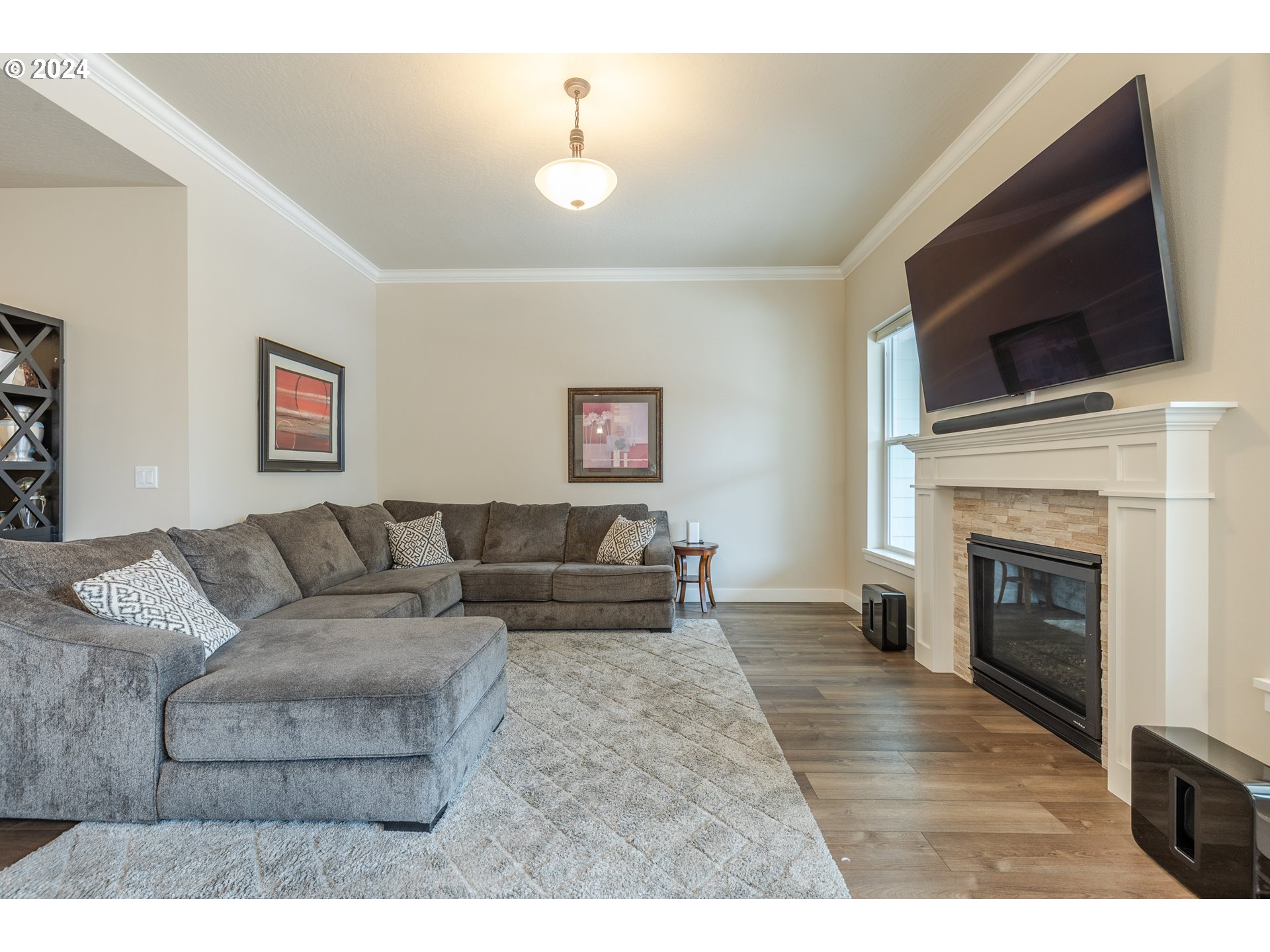 1044 West Olympic Street Springfield, OR 97477 - Photo 6 of 37 a living room with furniture and a fireplace
