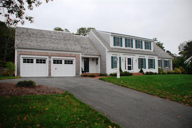 a large tree in front of a house