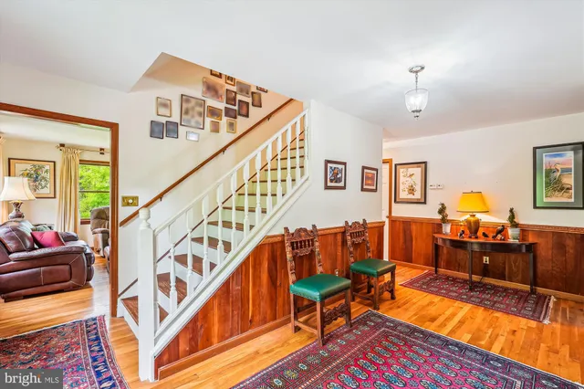 a view of entryway with wooden floor