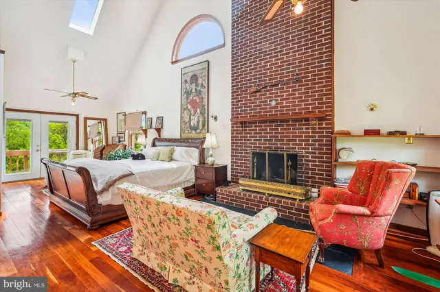 a bedroom with bed and a window