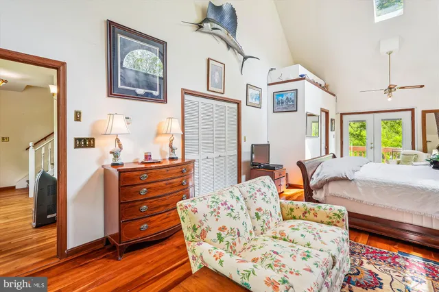 a bedroom with a bed dresser and a window