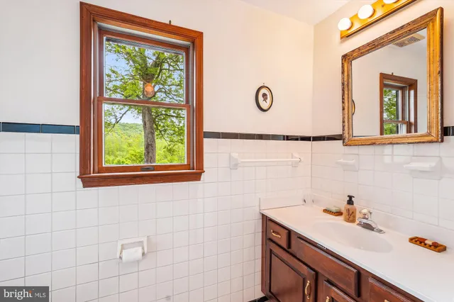 a view of a livingroom with furniture and a window